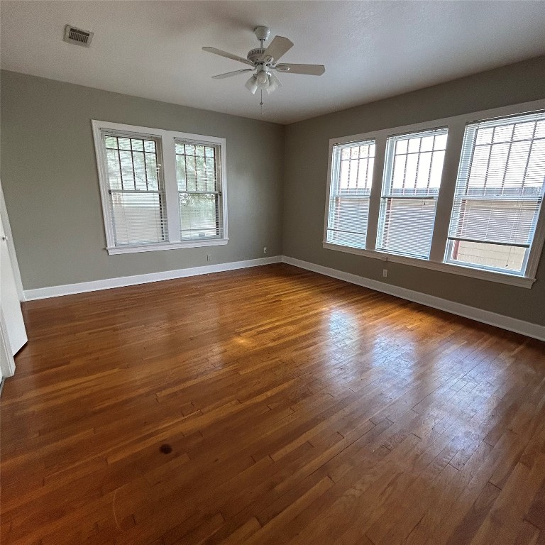 1115 West 22 1/2 Street Austin, TX 78705 - Photo 23 of 33 a view of an empty room with wooden floor and a window