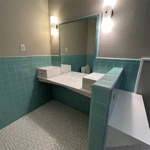 a room with pool table and window