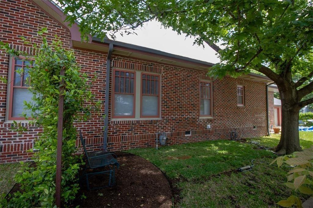 1115 West 22 1/2 Street Austin, TX 78705 - Photo 31 of 33 a view of a house with a yard