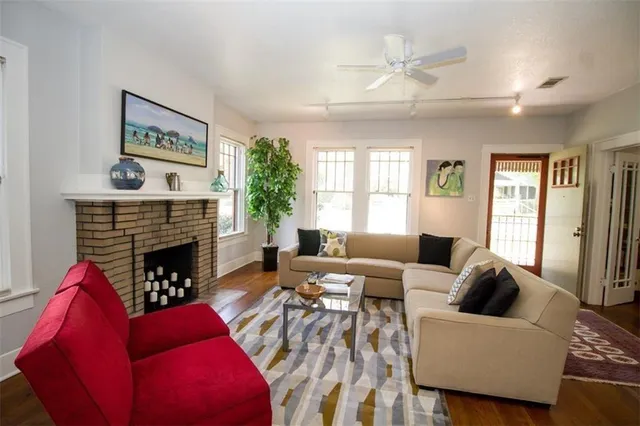 a living room with furniture and a fireplace