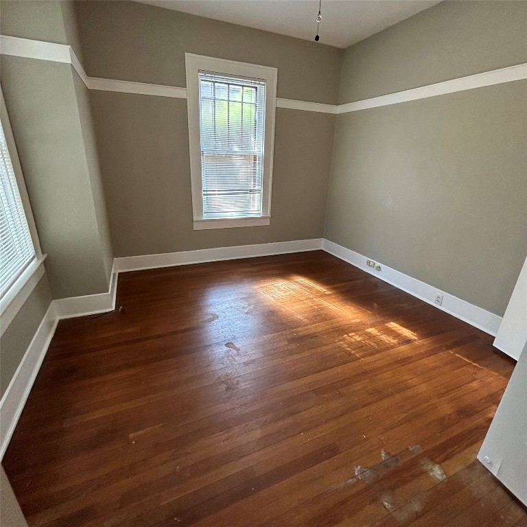 1115 West 22 1/2 Street Austin, TX 78705 - Photo 8 of 33 an empty room with wooden floor and windows