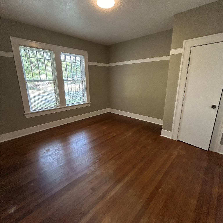 1115 West 22 1/2 Street Austin, TX 78705 - Photo 10 of 33 an empty room with wooden floor and windows
