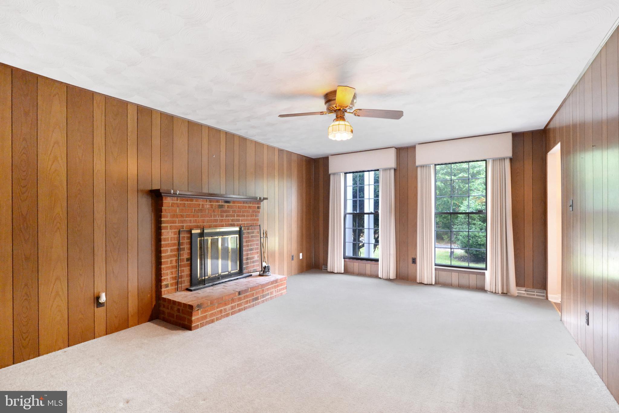 Family Room with wood-burning fireplace.