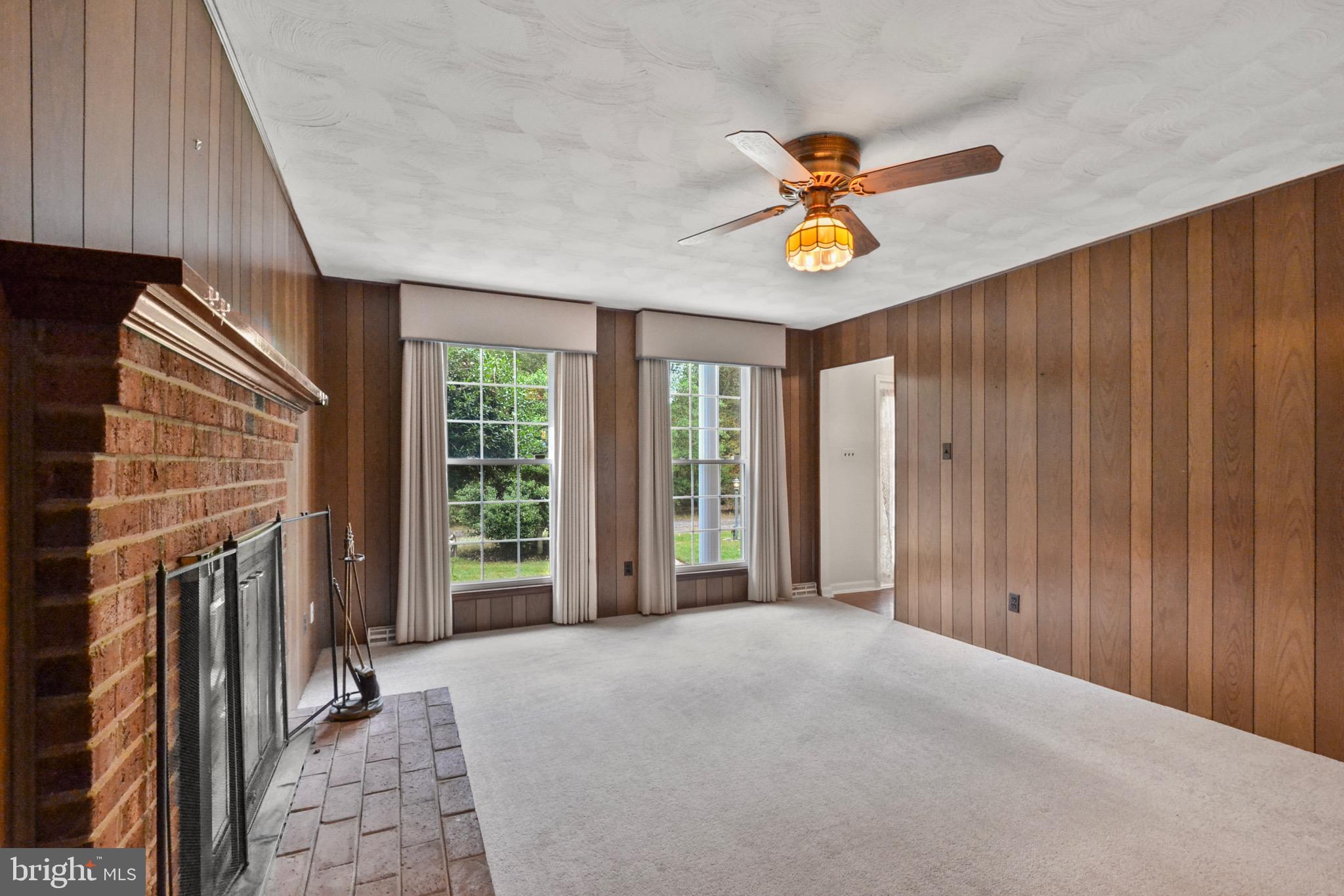 Family Room with wood-burning fireplace.