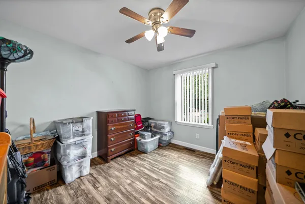 a bedroom with furniture and a window