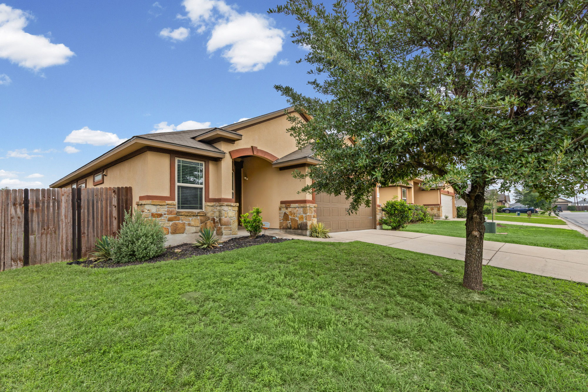 19308 Stokes Lane Pflugerville, TX 78660 - Photo 23 of 27 Stucco exterior featuring stone accents and a covered entry