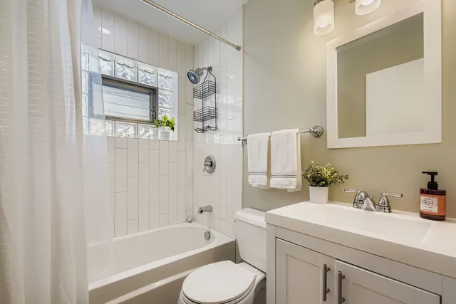 a bathroom with a sink toilet and bathtub