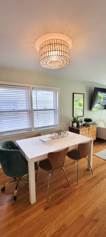 a workspace with furniture window and wooden floor