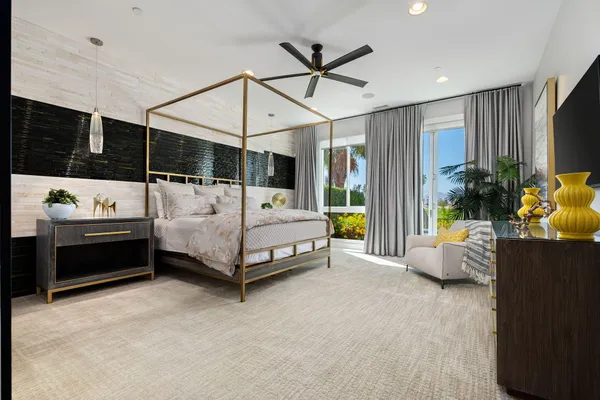 a bedroom with bed and windows
