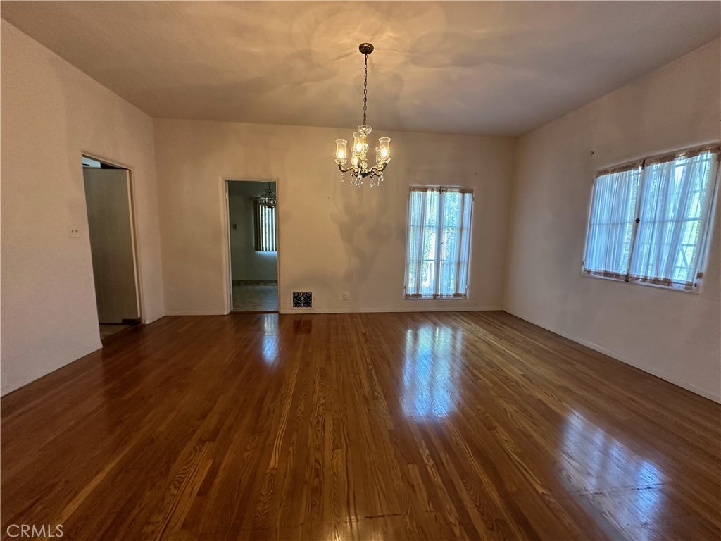 655 Westgate Street Pasadena, CA 91103 - Photo 4 of 20 a view of a room with wooden floor and windows