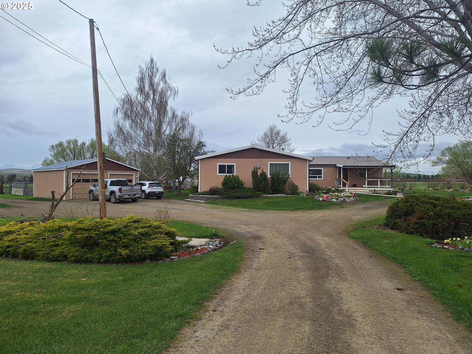 64929 Hurricane Creek Road Enterprise, OR 97828 - Photo 12 of 22 a front view of a house with a garden