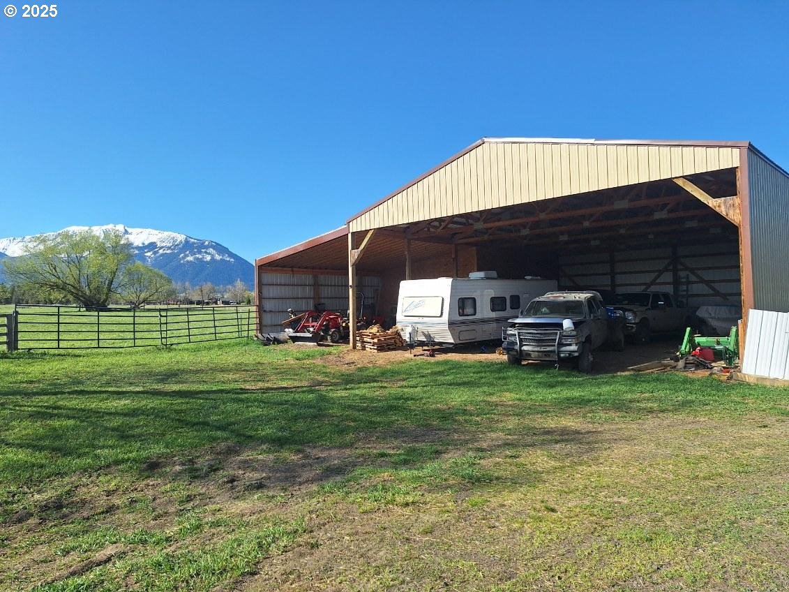 64929 Hurricane Creek Road Enterprise, OR 97828 - Photo 19 of 22 a view of a house with a back yard