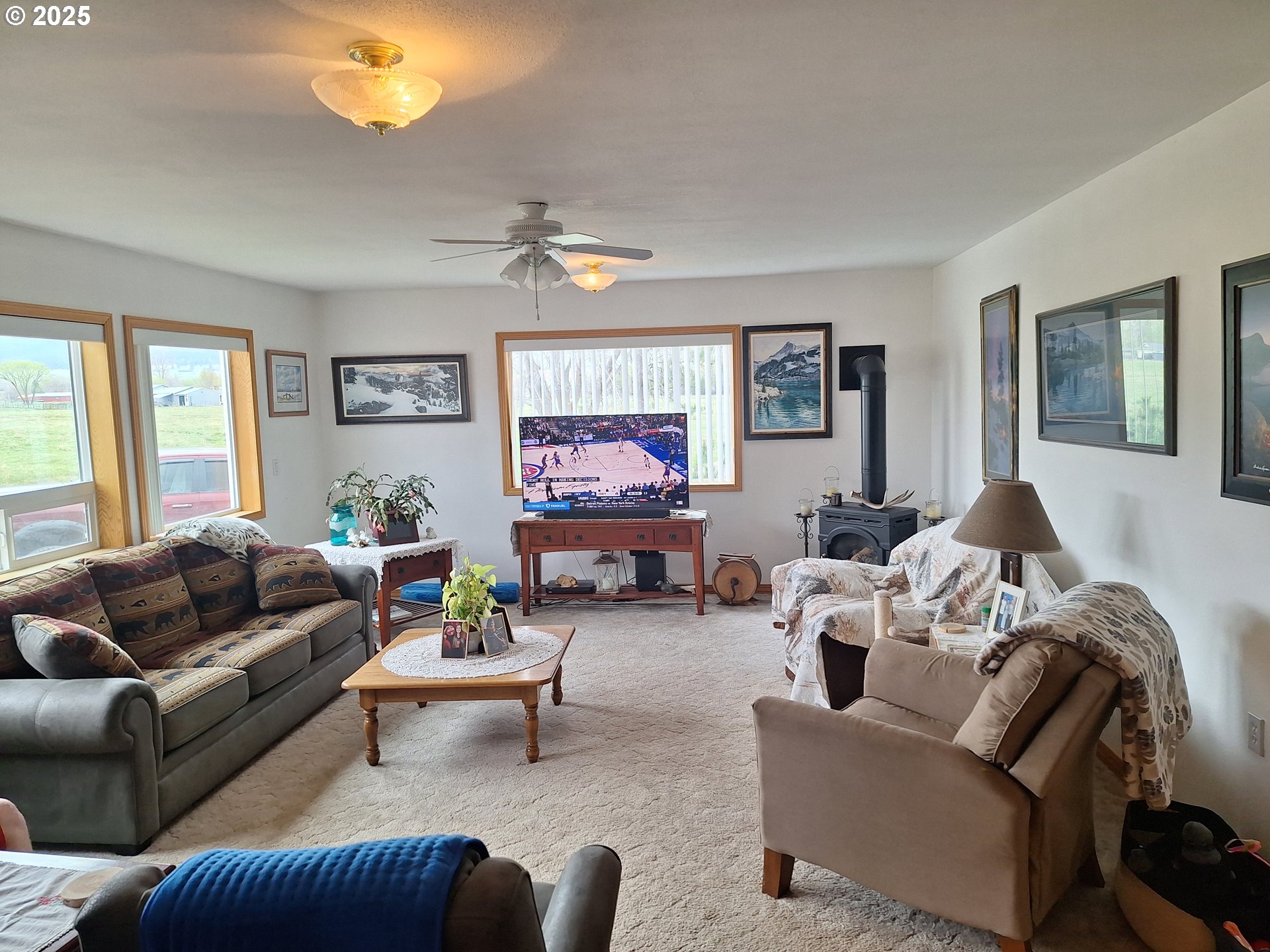 64929 Hurricane Creek Road Enterprise, OR 97828 - Photo 4 of 22 a living room with furniture a chandelier and a window