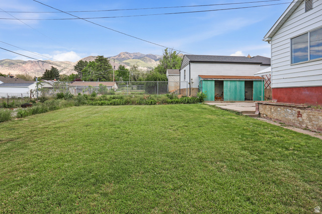 774 37th Street South Ogden, UT 84403 - Photo 26 of 47 Expansive green lawn with a chain-link fence border