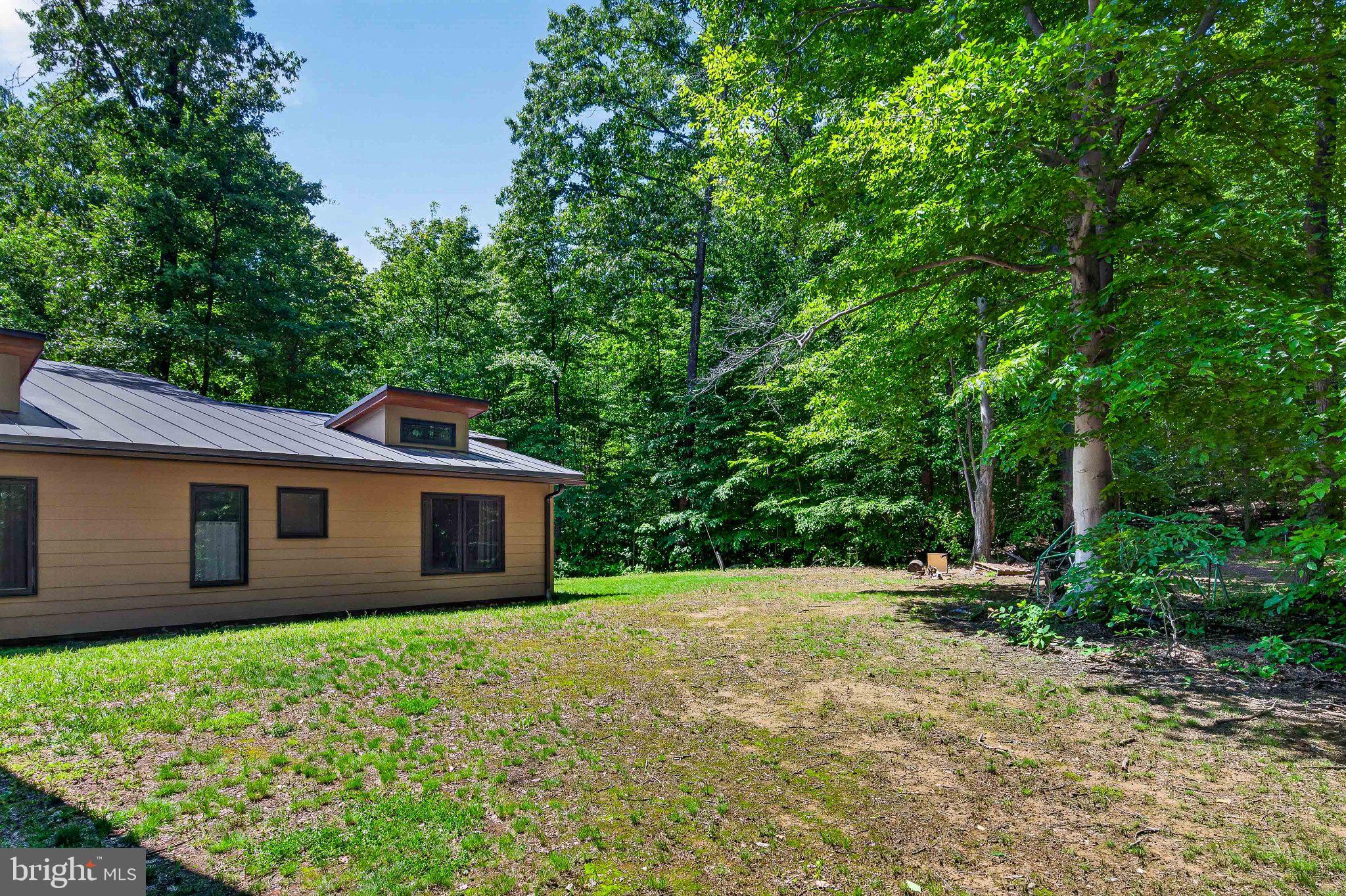 13311 Wilt Store Road Leesburg, VA 20176 - Photo 59 of 64 Serene home nestled in lush greenery.