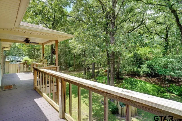 a view of balcony with deck and wooden floor