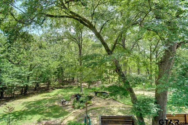 a backyard of a house with lots of green space