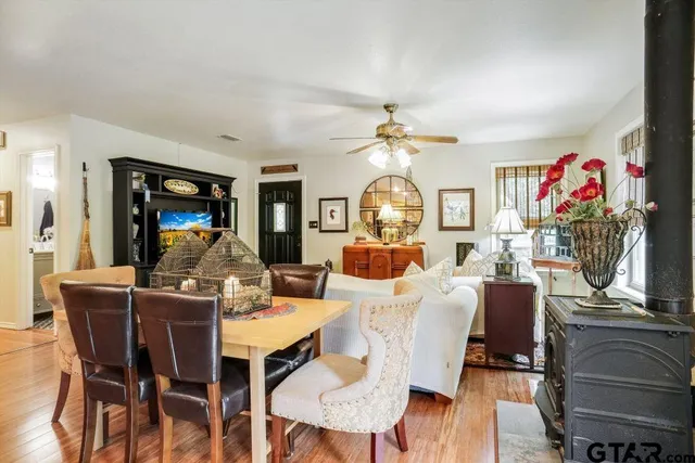 a view of a dining room with furniture and chandelier