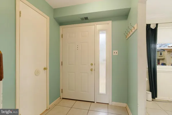 a view of an entryway with a door