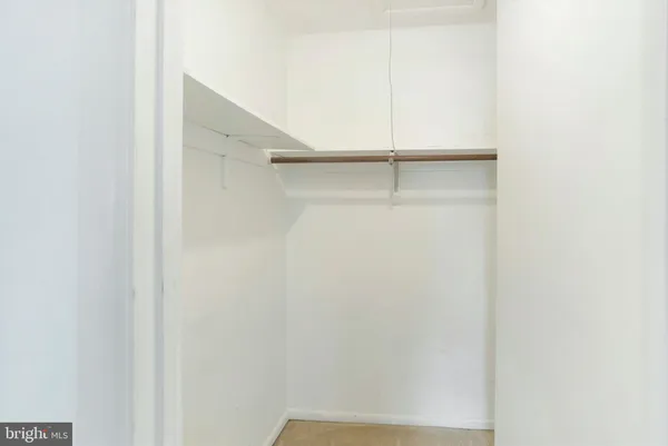 a view of an empty walk in closet