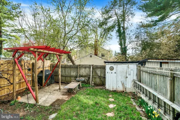 a patio with a yard table and chairs