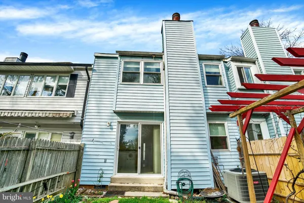 a car parked in front of a big house