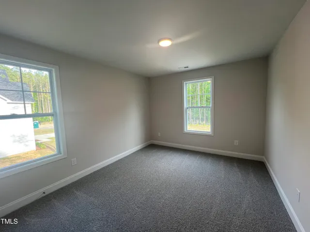 a bathroom with a sink double vanity and a window
