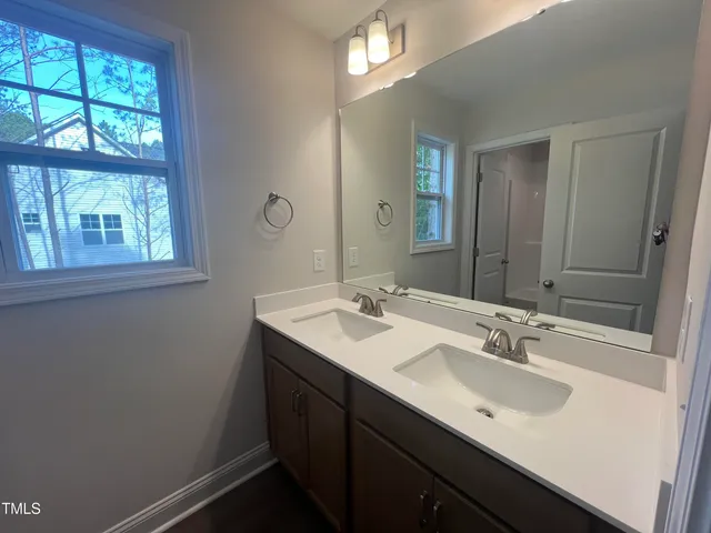a bathroom with a toilet and a bathtub