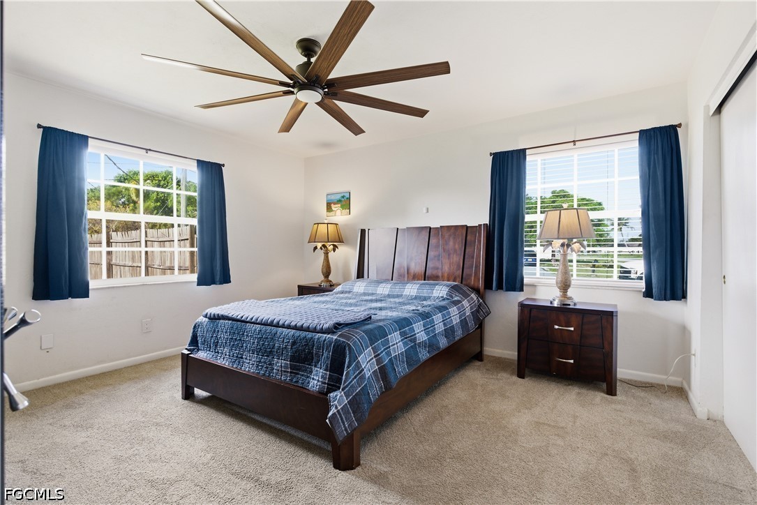 4960 20th Place Southwest Naples, FL 34116 - Photo 15 of 33 a bedroom with a bed and window