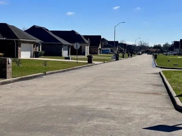 a view of house with outdoor space and sitting area