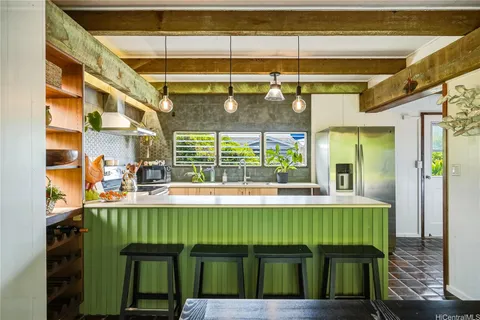 a kitchen with stainless steel appliances a sink and a stove
