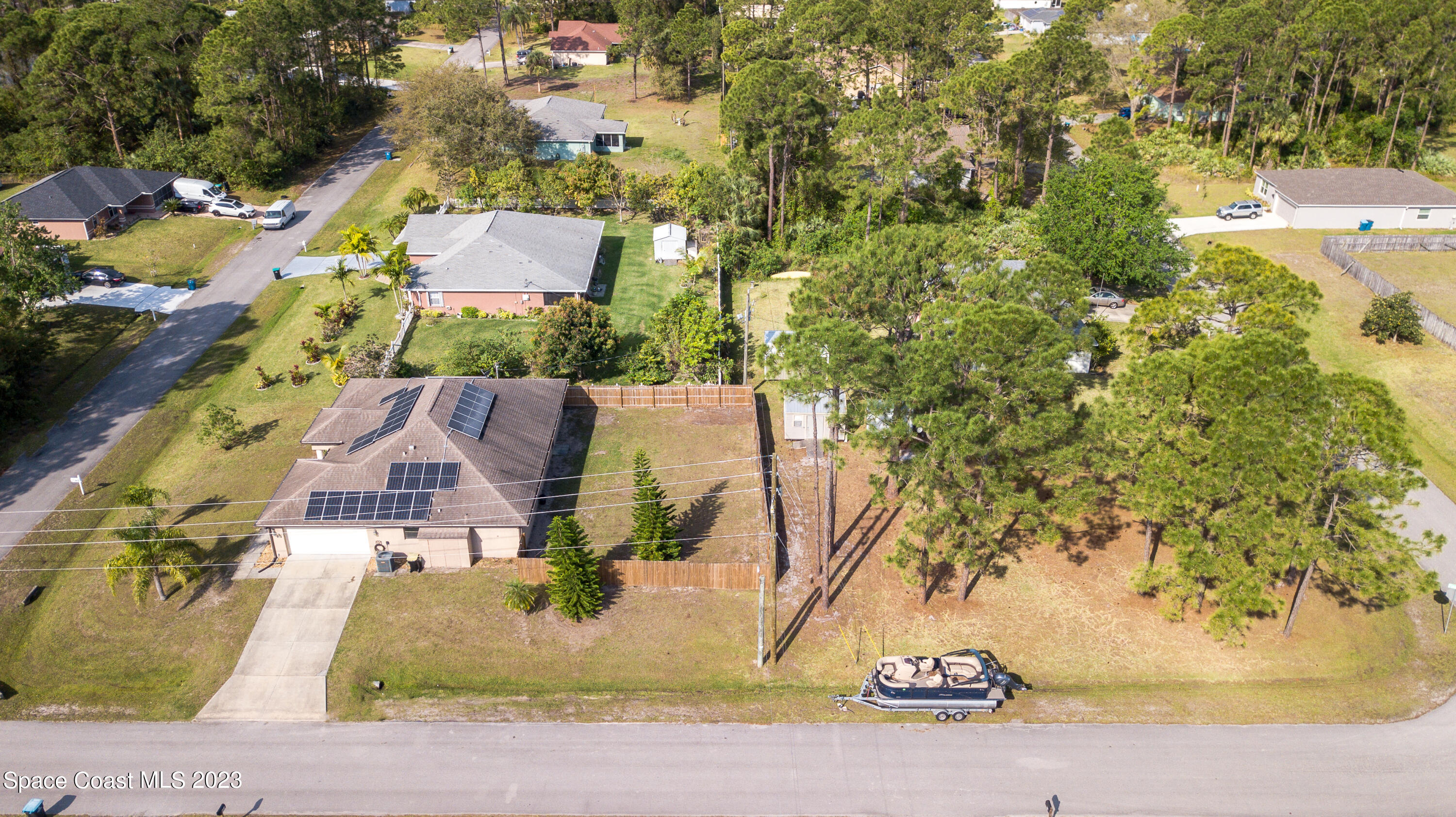1201 Daton Road Southwest Palm Bay, FL 32908 - Photo 3 of 46 an aerial view of residential houses with outdoor space