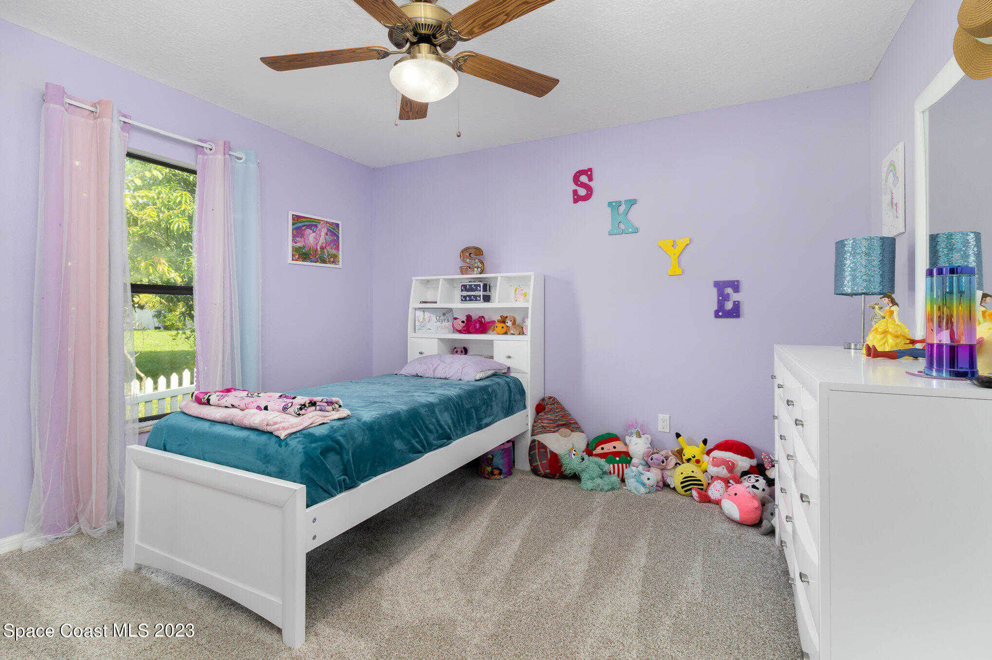 1201 Daton Road Southwest Palm Bay, FL 32908 - Photo 31 of 46 a bedroom with toys and a wooden floor