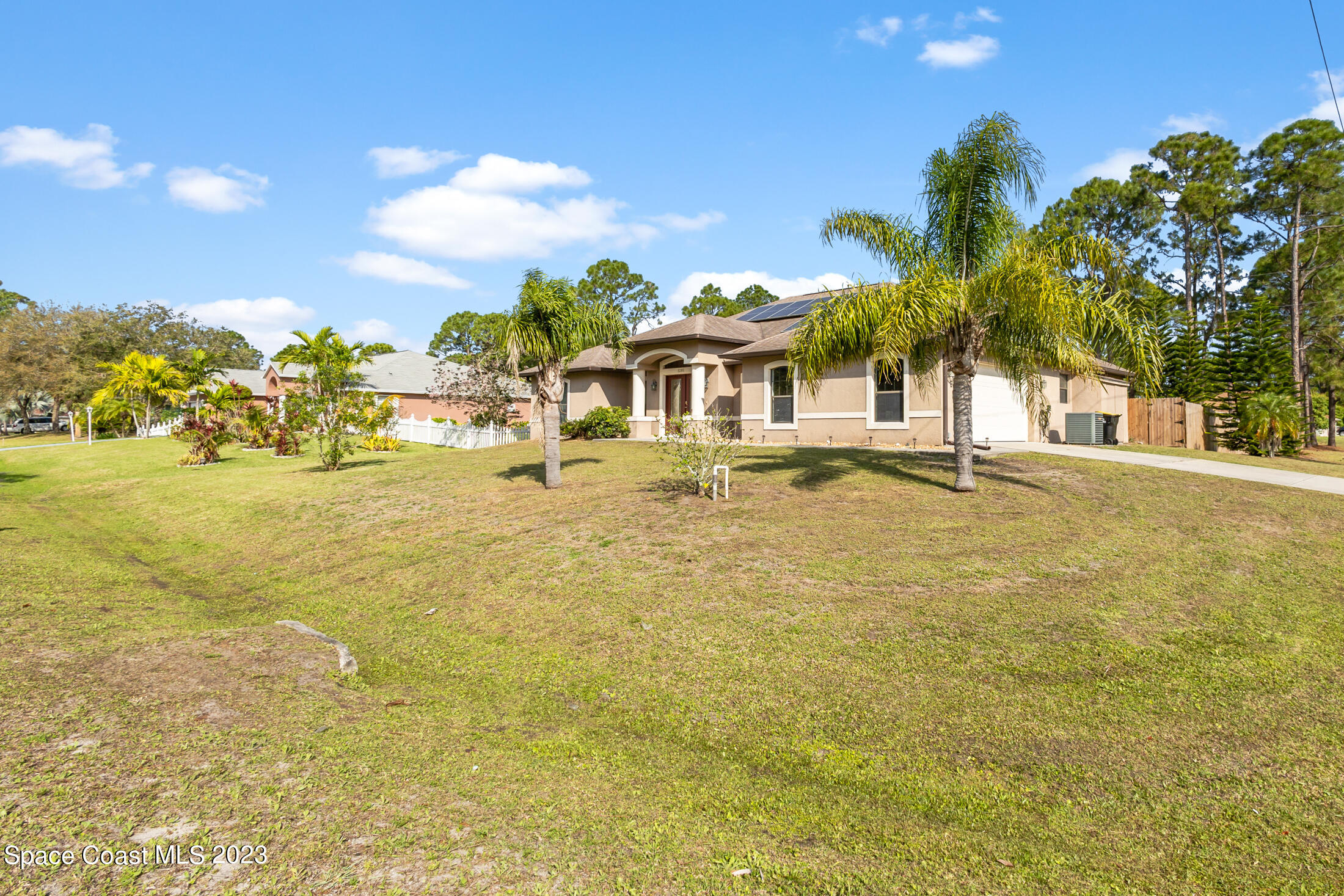 1201 Daton Road Southwest Palm Bay, FL 32908 - Photo 43 of 46 a front view of a house with a yard