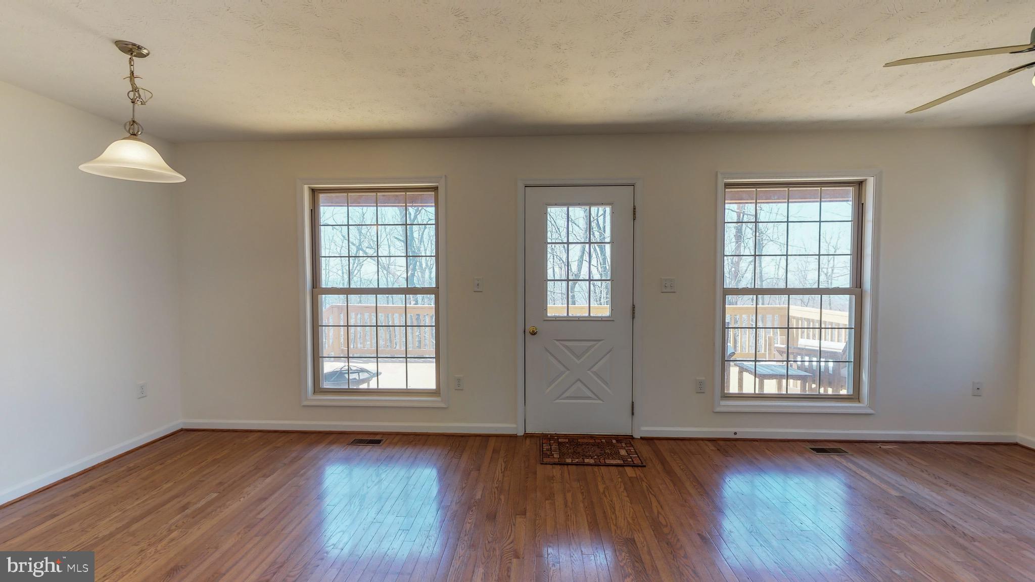 91 Mountain Top Road Front Royal, VA 22630 - Photo 11 of 35 Open living and access to deck