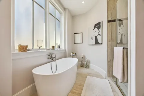 a bathroom with a bathtub and a sink