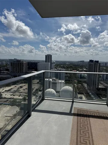 a view of roof with city view