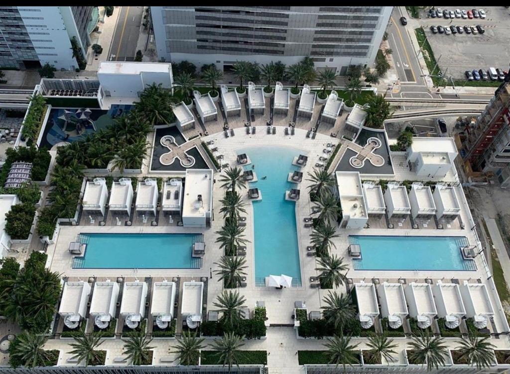 851 Northeast 1st Avenue, Unit 2606 Miami, FL 33132 - Photo 3 of 30 a front view of a house with a garden and plants