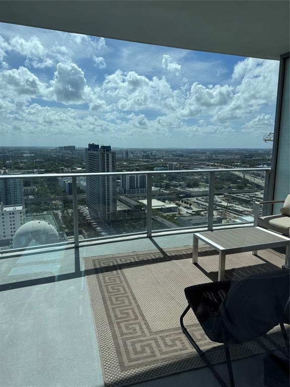 851 Northeast 1st Avenue, Unit 2606 Miami, FL 33132 - Photo 10 of 30 a view of a balcony with wooden floor