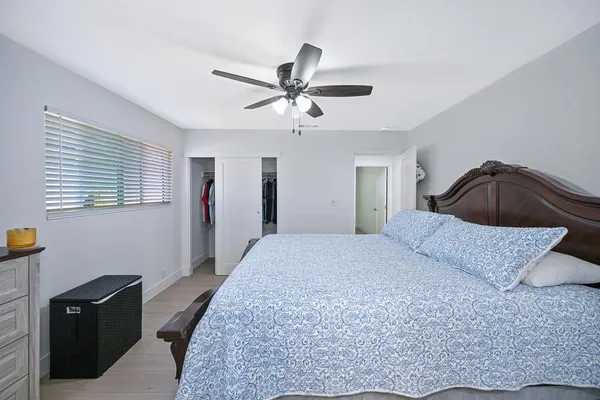 a bedroom with a bed and a closet