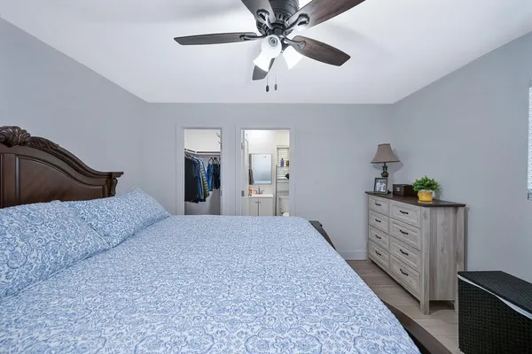 a bedroom with a bed and a dresser