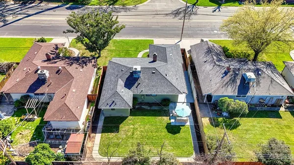 a aerial view of a house with a yard