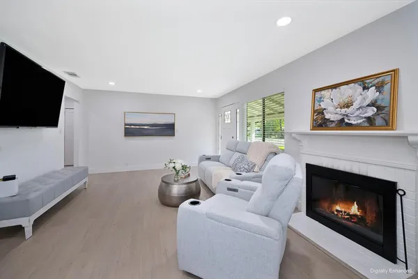 a living room with furniture and a fireplace