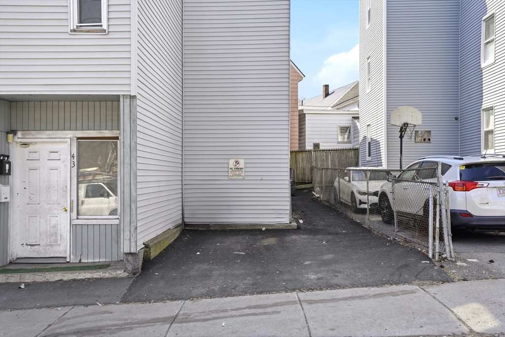43 Wamesit Street Lowell, MA 01852 - Photo 34 of 34 a view of a patio with table and chairs