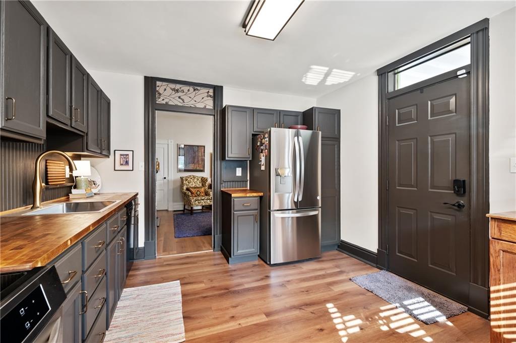255 Edmond Street Pittsburgh, PA 15224 - Photo 18 of 50 a kitchen with a refrigerator and a sink