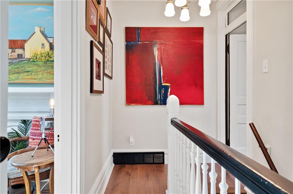 255 Edmond Street Pittsburgh, PA 15224 - Photo 27 of 50 a view of a hallway with furniture and wooden floor