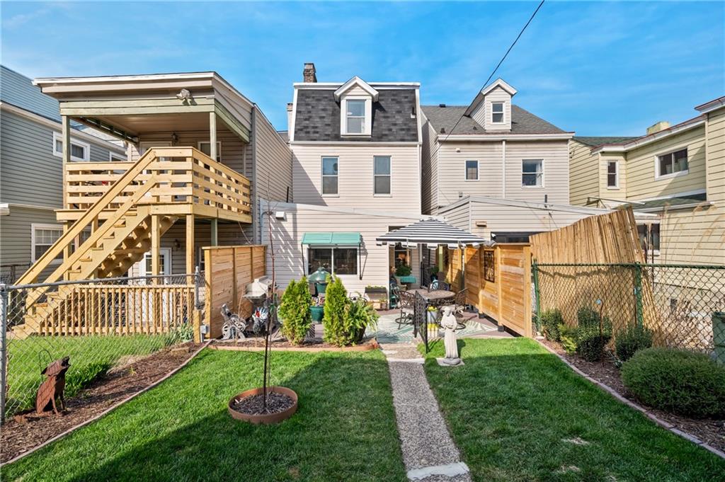 255 Edmond Street Pittsburgh, PA 15224 - Photo 42 of 50 a front view of a house with a yard table and chairs