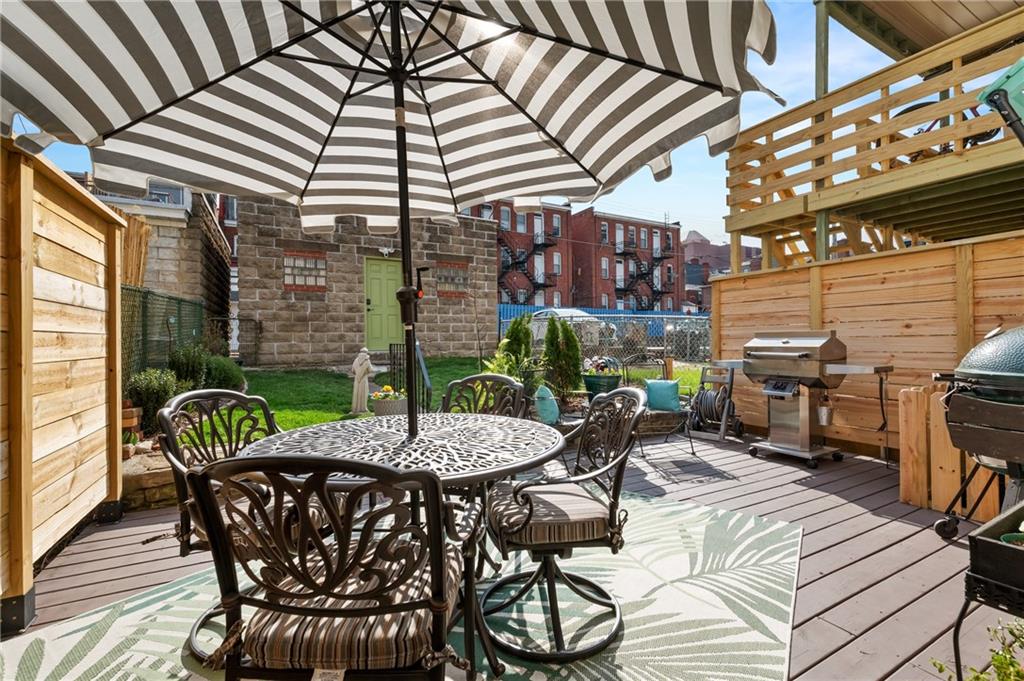 255 Edmond Street Pittsburgh, PA 15224 - Photo 45 of 50 a view of a patio with a table and chairs under an umbrella