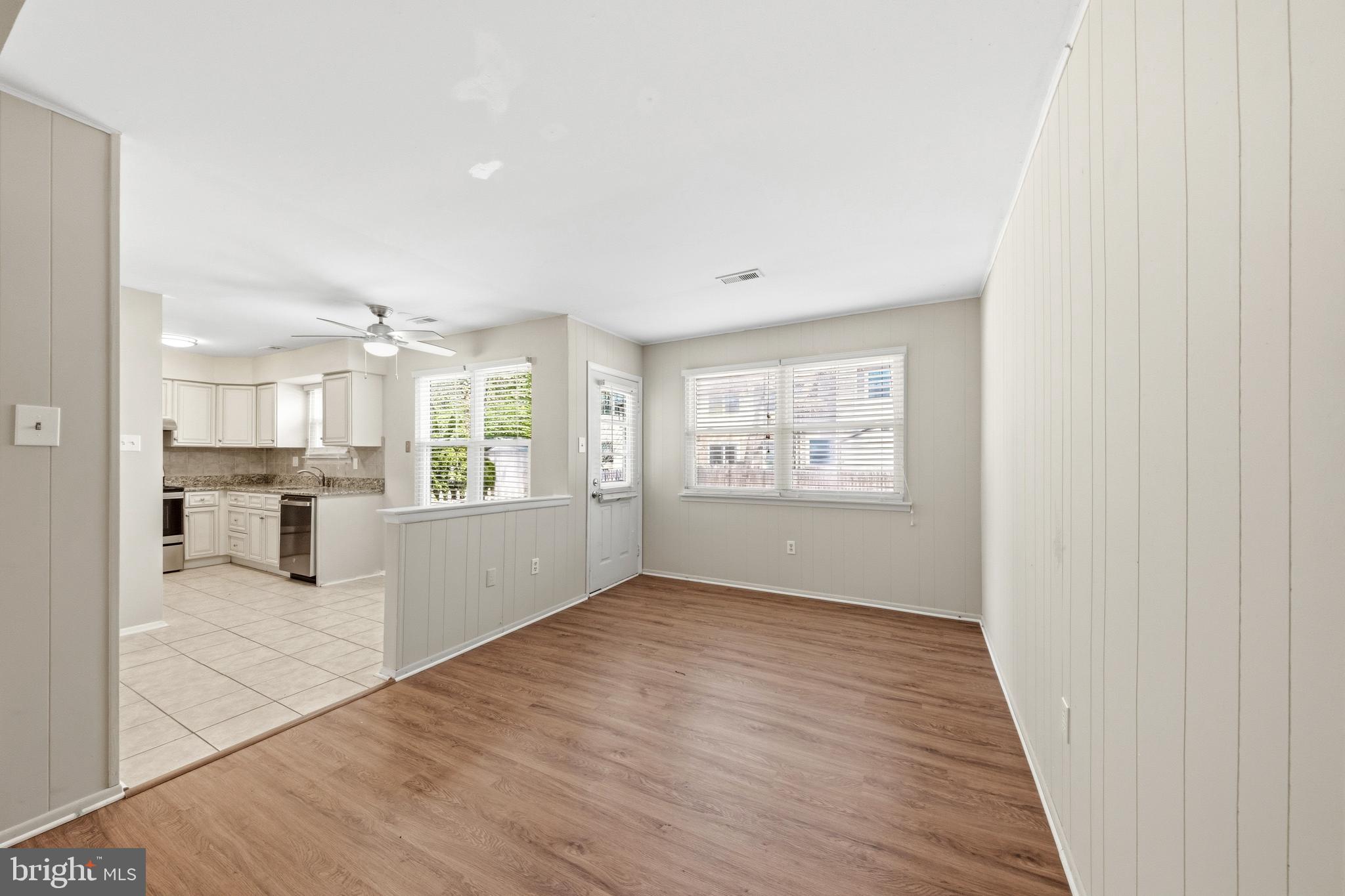 202 Shady Lane Marlton, NJ 08053 - Photo 12 of 38 wooden floor in an empty room and a kitchen