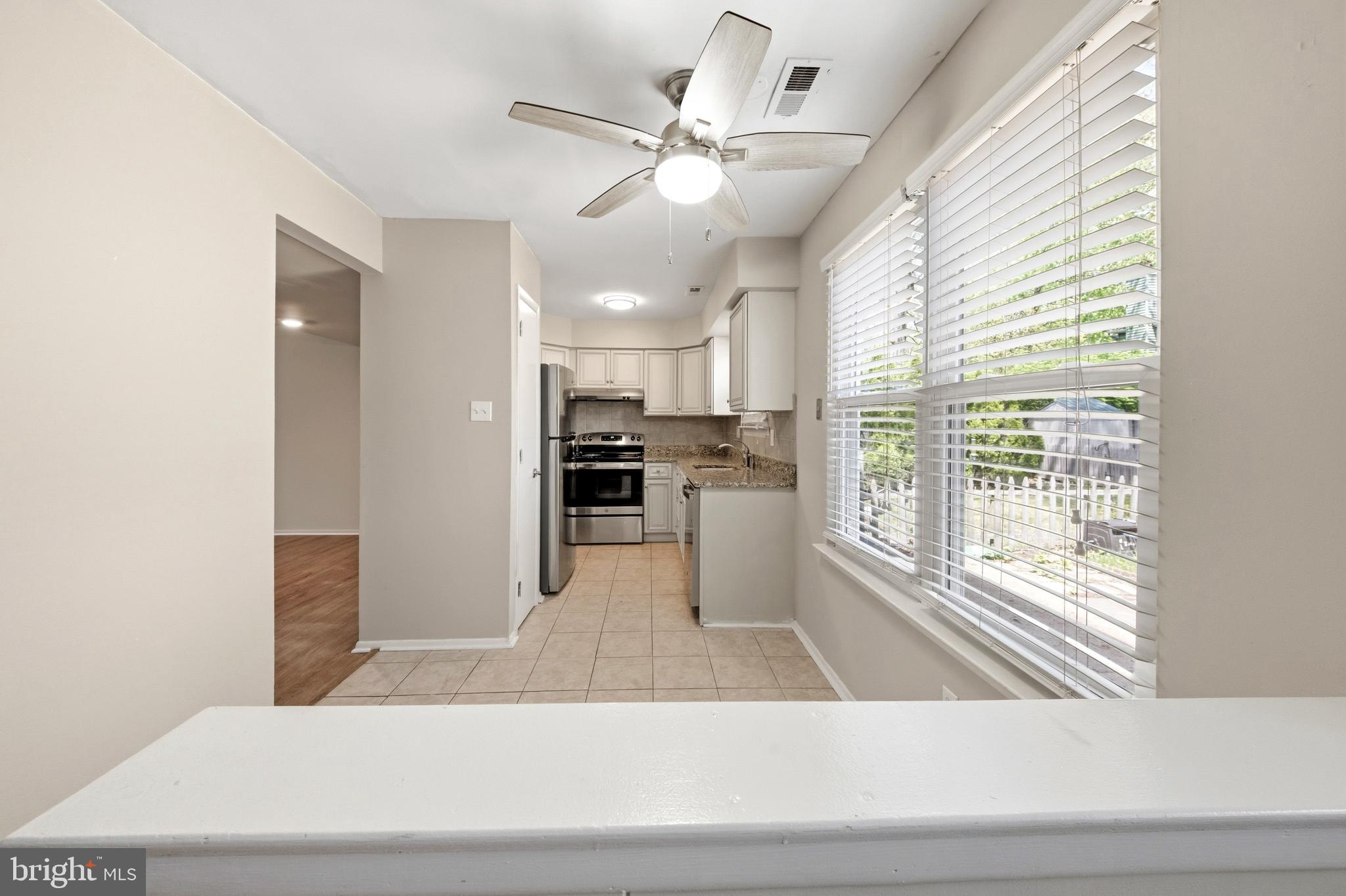 202 Shady Lane Marlton, NJ 08053 - Photo 13 of 38 a view of a kitchen with wooden floor and a kitchen counter top space